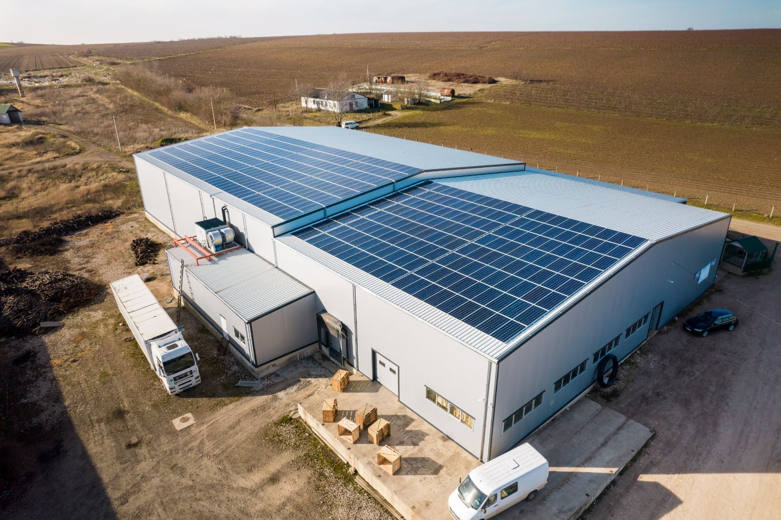 Industrial rooftop solar installation across large warehouse buildings